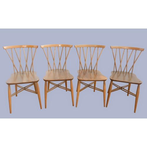 302 - A set of four Ercol beech and elm candlestick chairs, c.1960s, model 376, having crossed spindle bac... 