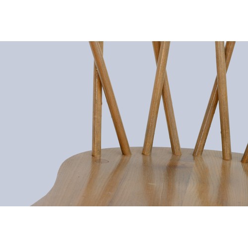 302 - A set of four Ercol beech and elm candlestick chairs, c.1960s, model 376, having crossed spindle bac... 