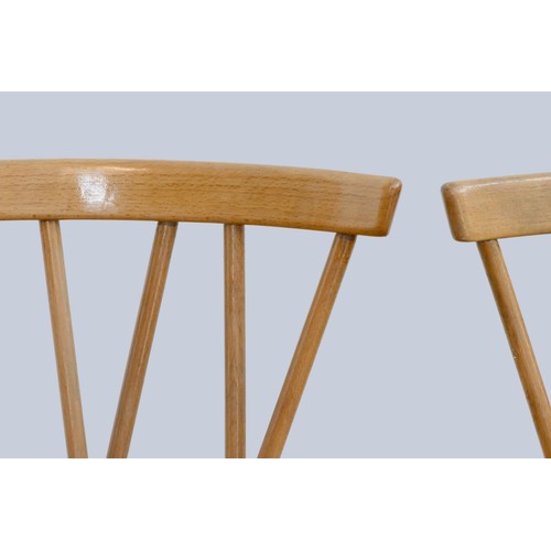 302 - A set of four Ercol beech and elm candlestick chairs, c.1960s, model 376, having crossed spindle bac... 