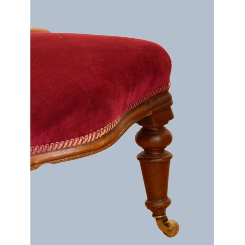 307 - A Victorian mahogany framed nursing chair, having spoon button back, upholstered in a burgundy drylo... 