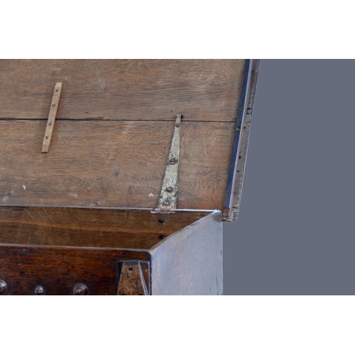 312 - A second half of the 17th century oak bible box, with plank top over a front with applied mouldings,... 