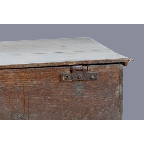 312 - A second half of the 17th century oak bible box, with plank top over a front with applied mouldings,... 