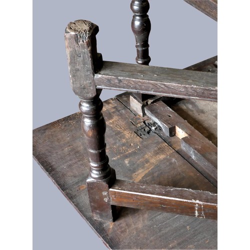 313 - A late 17th century oak gate leg table, with associated rectangular plank top, raised on baluster le... 