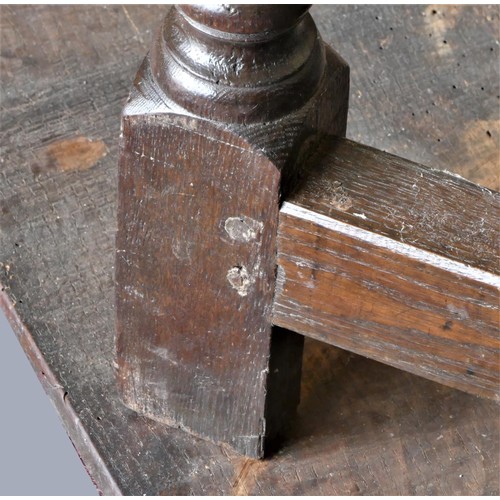 313 - A late 17th century oak gate leg table, with associated rectangular plank top, raised on baluster le... 