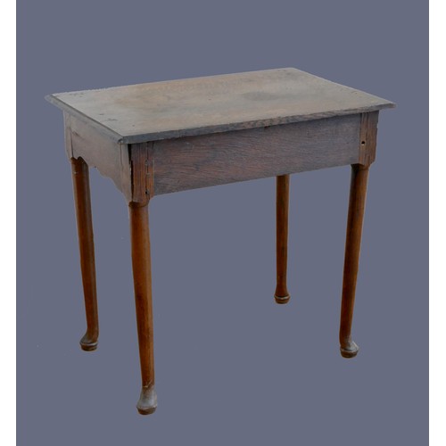 316 - An 18th century oak lowboy, with single frieze drawer, over tapering legs with pad feet.