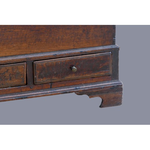 317 - An 18th century oak joined oak Welsh coffer Bach, of small proportions, with moulded lid over a plai... 