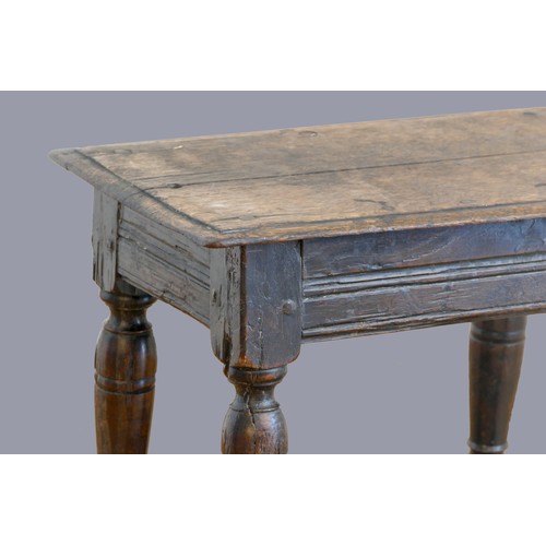 321 - A 17th century oak joint stool, with plank top and thumb nail edge, line incised frieze, on turned b... 