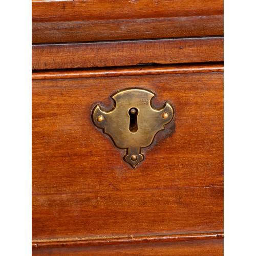 323 - A George III mahogany kneehole desk, with shaped top, pull out writing slide, over a single frieze d... 