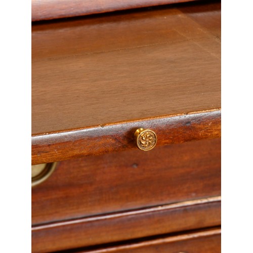 323 - A George III mahogany kneehole desk, with shaped top, pull out writing slide, over a single frieze d... 