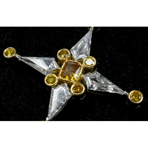 64 - An 18ct gold and platinum yellow and white diamond star pendant, by DICG, claw set with four kite sh... 