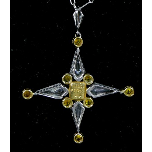 64 - An 18ct gold and platinum yellow and white diamond star pendant, by DICG, claw set with four kite sh... 