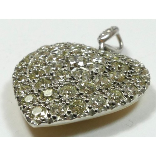 65 - A diamond set heart pendant, pave set with 43 brilliant cut stones, approximate weight 3.40cts, colo... 