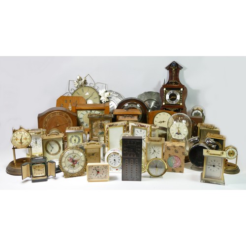 A collection of manual wind and quartz clocks, to include anniversary ...