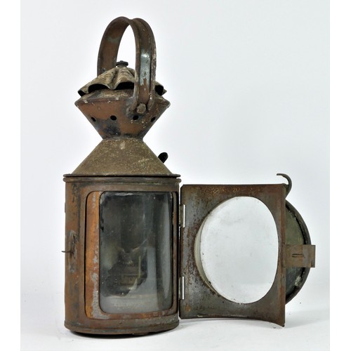 91 - A L.N.E.R  three aspect hand lamp, complete with burner, 32cm tall