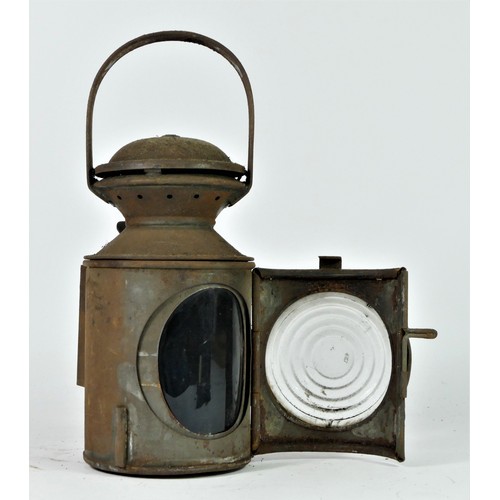 93 - An L.N.E.R three aspect hand lamp, complete with burner, 28cm tall