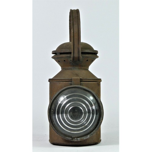 93 - An L.N.E.R three aspect hand lamp, complete with burner, 28cm tall