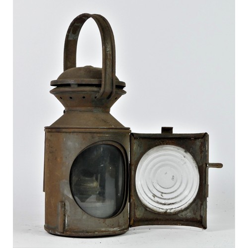 93 - An L.N.E.R three aspect hand lamp, complete with burner, 28cm tall