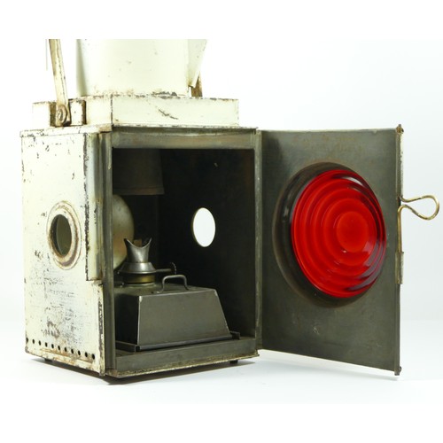 104 - BR(M) White tail lamp with burner.