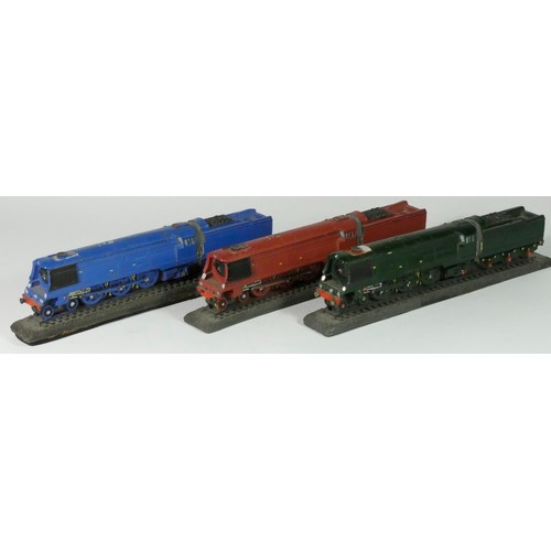 148 - Three hand painted OO scale cold cast models of locos and tenders on rails, including three West Cou... 