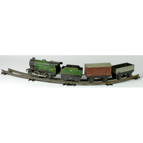 160 - A Hornby clockwork / wind up O gauge loco and tender, 45746 in BR green livery, together with a 12T ... 