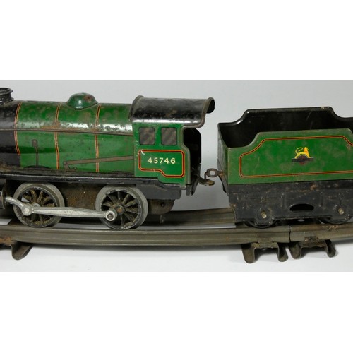 160 - A Hornby clockwork / wind up O gauge loco and tender, 45746 in BR green livery, together with a 12T ... 