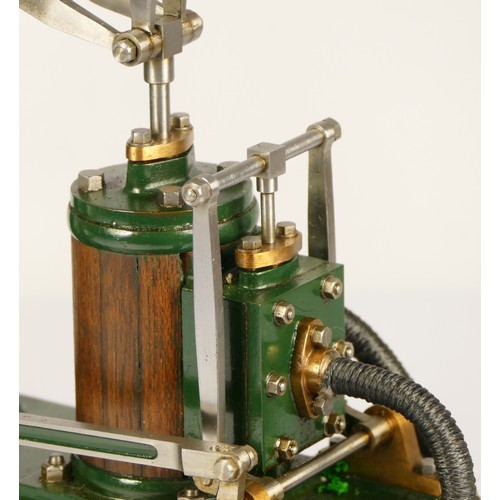 179 - A Stuart Turner stationery beam engine comprising of green body with vertical single cylinder engine... 