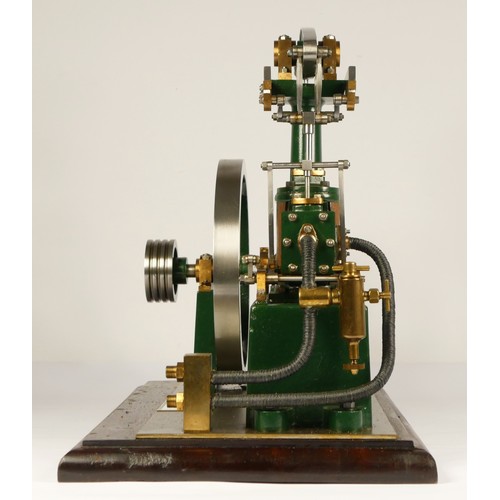 179 - A Stuart Turner stationery beam engine comprising of green body with vertical single cylinder engine... 