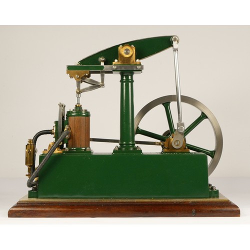 179 - A Stuart Turner stationery beam engine comprising of green body with vertical single cylinder engine... 