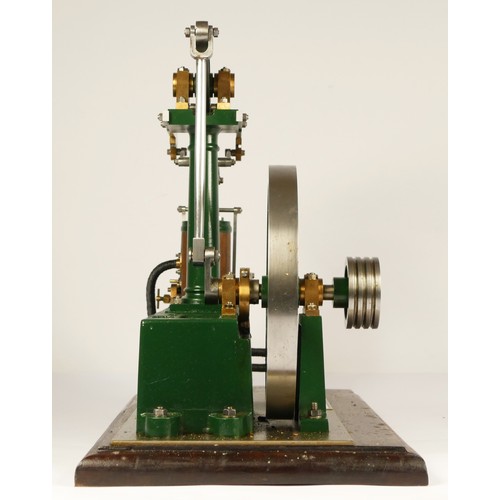 179 - A Stuart Turner stationery beam engine comprising of green body with vertical single cylinder engine... 