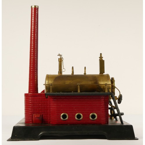 187 - A Marklin style horizonal boiler live steam stationary engine, of tin plate construction, red and bl... 