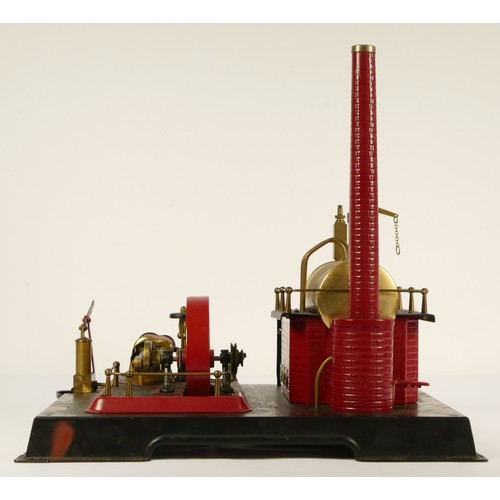 187 - A Marklin style horizonal boiler live steam stationary engine, of tin plate construction, red and bl... 