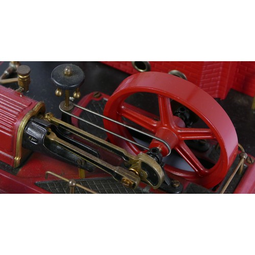 187 - A Marklin style horizonal boiler live steam stationary engine, of tin plate construction, red and bl... 