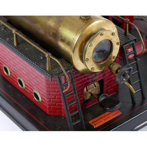 187 - A Marklin style horizonal boiler live steam stationary engine, of tin plate construction, red and bl... 