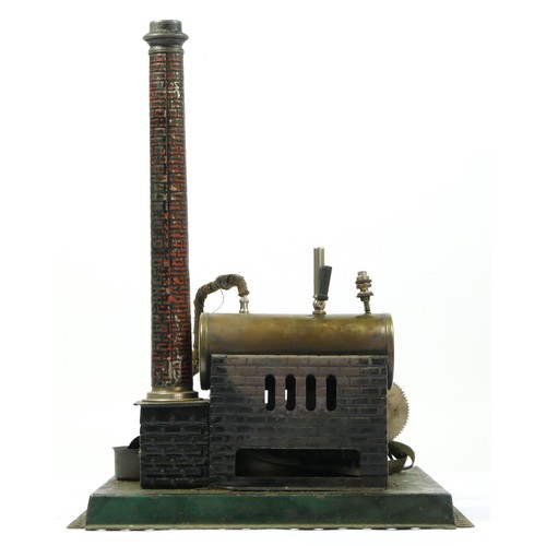 199 - A Doll et Cie vintage tinplate live steam horizontal engine, 24 x 21cm.
Doll et Cie (DC), were found... 