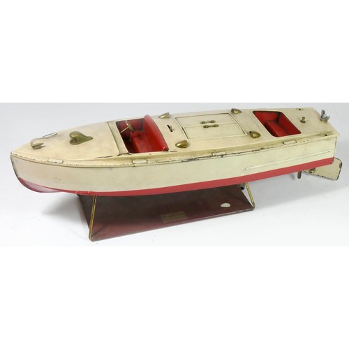 206 - A Lionel Craft tinplate boat, wind up, key and stand, 43cm long, together with a Golden Streak tinpl... 