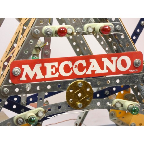 215 - A Meccano shop display, Ferris Wheel, illuminated, powered, on a wooden base, 50cm x 62cm x 38cm