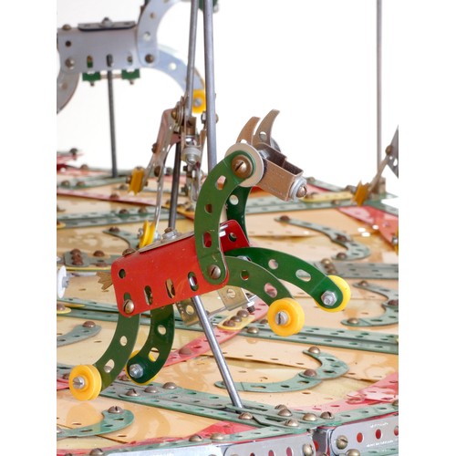 218 - A Meccano shop display, 24 horse carousel, balanced on an electric motor including lights (not funct... 