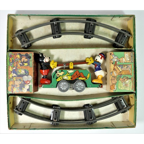 224 - A Mickey Mouse Handcar clockwork / wind up tinplate toy, with Mickey Mouse and Donald Duck operating... 