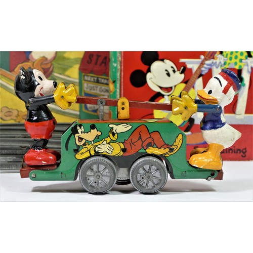 224 - A Mickey Mouse Handcar clockwork / wind up tinplate toy, with Mickey Mouse and Donald Duck operating... 