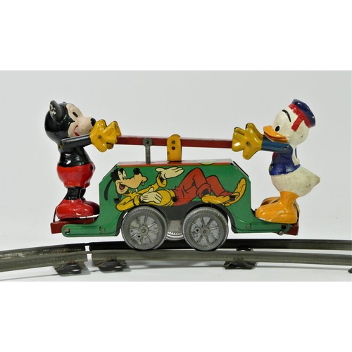 224 - A Mickey Mouse Handcar clockwork / wind up tinplate toy, with Mickey Mouse and Donald Duck operating... 