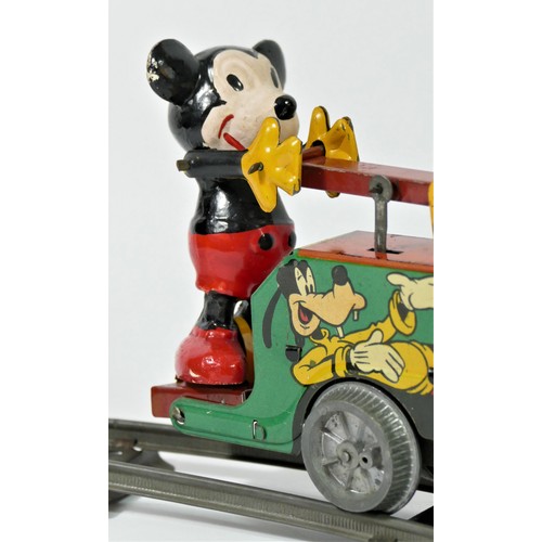 224 - A Mickey Mouse Handcar clockwork / wind up tinplate toy, with Mickey Mouse and Donald Duck operating... 