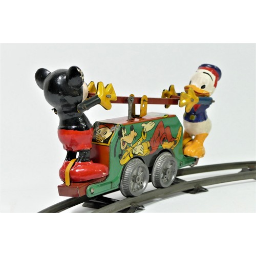 224 - A Mickey Mouse Handcar clockwork / wind up tinplate toy, with Mickey Mouse and Donald Duck operating... 