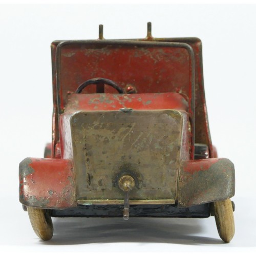 228 - A vintage red painted metal fire engine, probably American, white rubber tyres, lacking ladder, 30cm... 