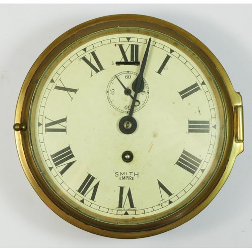 283 - A Smiths Empire bulk had clock, brass case, Roman numeral dial with seconds hand, 15cm diameter