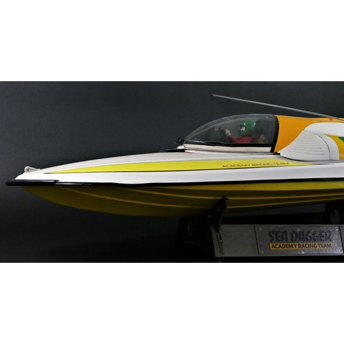 314 - Academy Sea Dagger, c.2000, a radio controlled speed boat, single screw out board motor, stand, 80 x... 