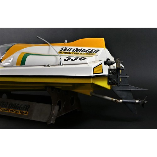 314 - Academy Sea Dagger, c.2000, a radio controlled speed boat, single screw out board motor, stand, 80 x... 