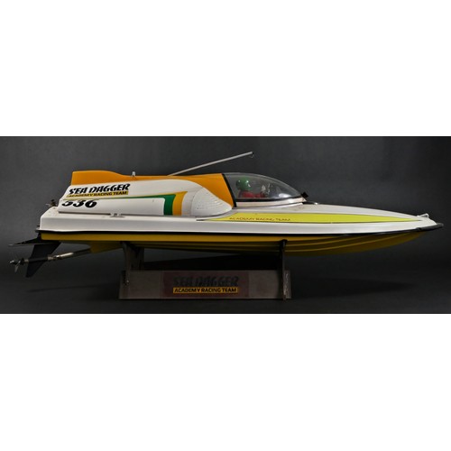 314 - Academy Sea Dagger, c.2000, a radio controlled speed boat, single screw out board motor, stand, 80 x... 