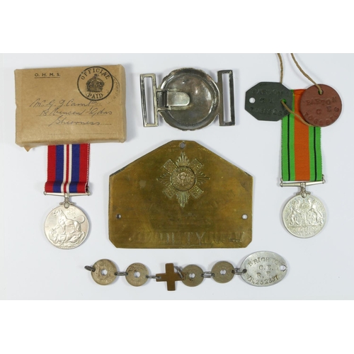 400 - A Collection of Militaria, to include a brass Scots Guard Bed Plate, 2691274, W. Mulholland, a Naval... 