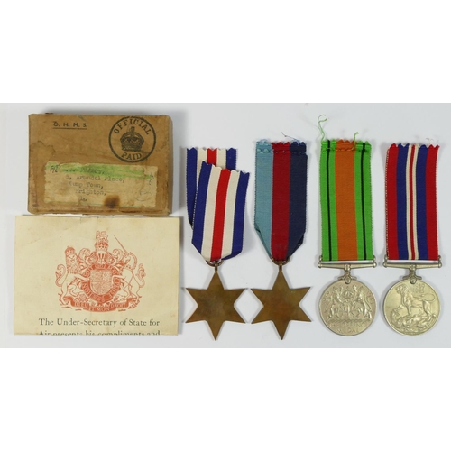 403 - WWII a group of four, 1939-45 Star, France and Germany Star, Defense and War, papers and boxed addre... 