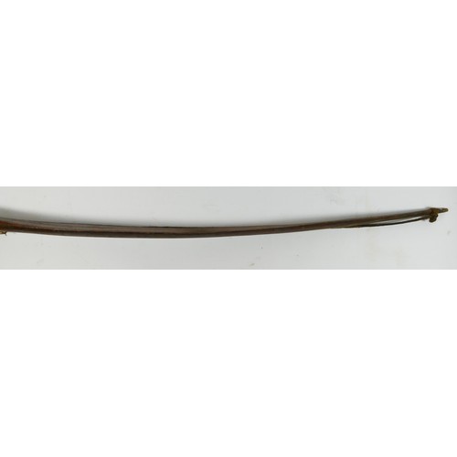 411 - A Canadian bow with cross hatched carved decoration, 148cm, with owners label 